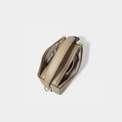 A top view of the Mini Double Zip Bag in beige color, displaying its two spacious zippered compartments. The bag, made from pebbled leather, features a light-colored fabric lining for organized storage. The sturdy top handle and gold-tone hardware are visible, enhancing the bag’s functional and elegant design