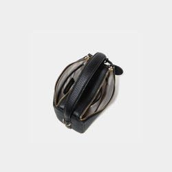 A top view of the Mini Double Zip Bag in black color, displaying its two spacious zippered compartments. The bag, made from pebbled leather, features a light-colored fabric lining for organized storage. The sturdy top handle and gold-tone hardware are visible, enhancing the bag’s functional and elegant design