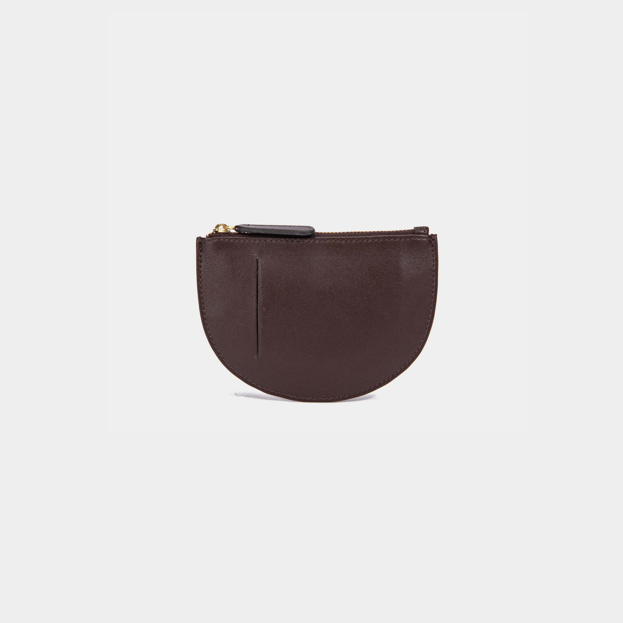 The back view of a brown Half Moon Coin Purse made of goat leather with a card slot on the back and a top zipper.