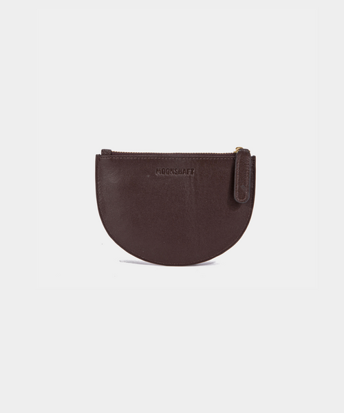 A brown Half Moon Coin Purse made of goat leather with a zipper on the top and an embossed MOONSHAFT logo on the front.