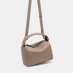 The taupe Loaf Bag is shown with an adjustable shoulder strap attached. It is made of pebbled leather with a structured, boxy shape. The top handle allows for versatile carrying, and the bag features a gold-tone zipper closure with subtle gold accents, including the MOONSHAFT logo embossed on the front. The minimalist design is elevated by the soft, neutral taupe color, making it both practical and stylish.