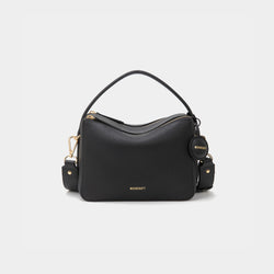 A black-colored upgraded double zip leather bag displayed from a front angle against a plain background. The bag showcases a minimalist design with pebbled leather and two prominent zippered compartments. The structured form and gold-tone zippers add both functionality and a sleek, modern touch. The neutral sandstone color enhances the bag's versatile appeal, making it suitable for a variety of outfits and occasions.