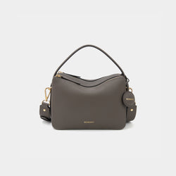 A charcoal-colored upgraded double zip leather bag displayed from a front angle against a plain background. The bag showcases a minimalist design with pebbled leather and two prominent zippered compartments. The structured form and gold-tone zippers add both functionality and a sleek, modern touch. The neutral charcoal color enhances the bag's versatile appeal, making it suitable for a variety of outfits and occasions.