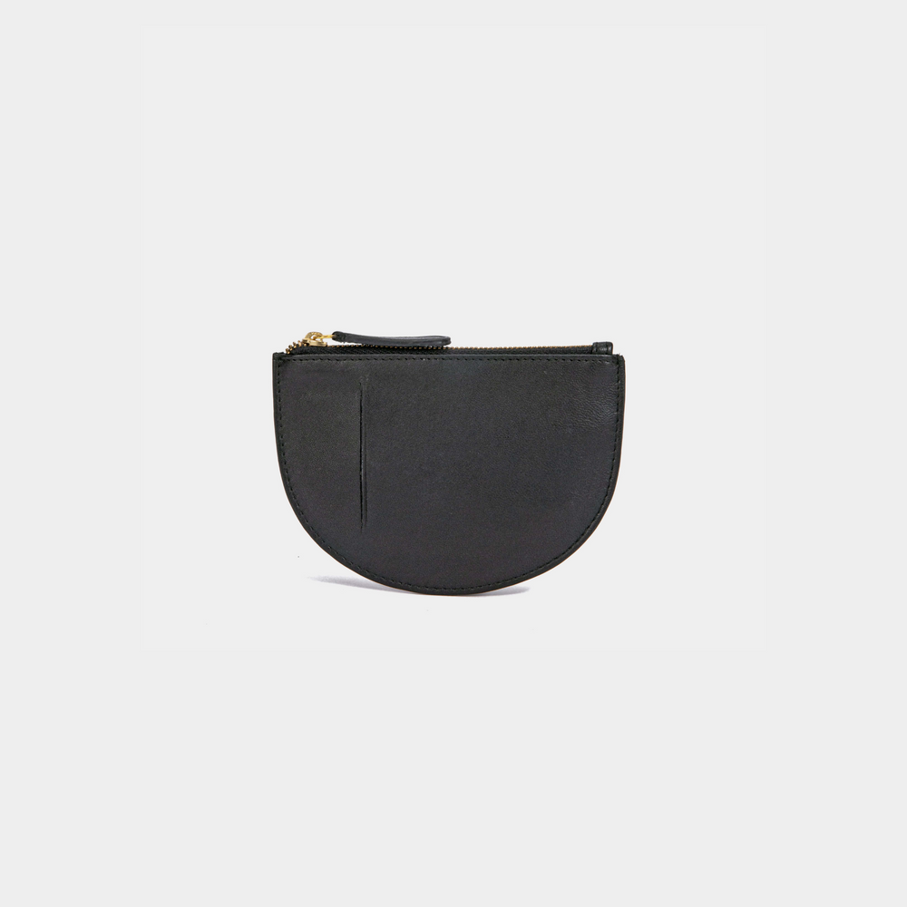 The back view of a black Half Moon Coin Purse made of goat leather with a card slot on the back and a top zipper.