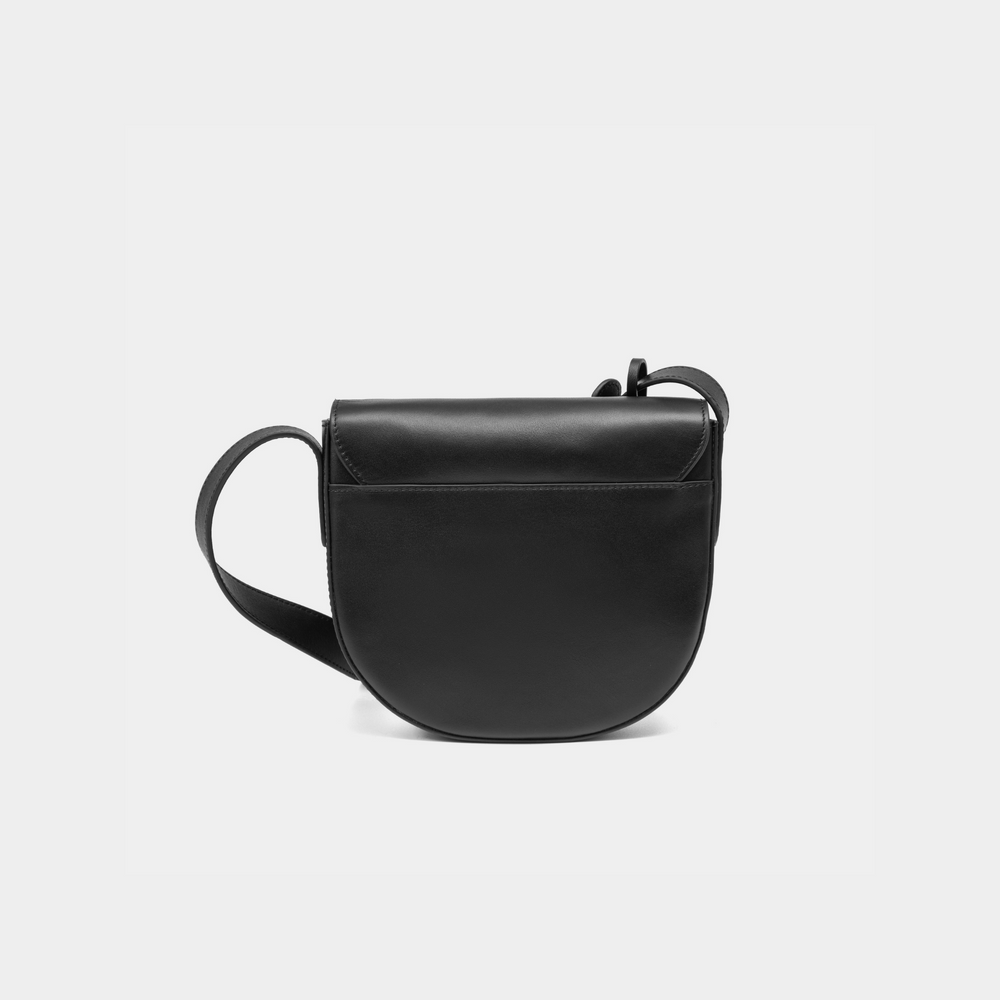 A back view of the half-moon crossbody bag in black leather, showcasing its smooth, rounded structure. The back of the bag features clean, minimalist detailing, highlighting the high-quality craftsmanship. The adjustable strap connects seamlessly to the body of the bag, maintaining its sleek, functional design.